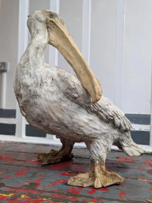 Early 20th Century Weathered French Clay Pelican Statue.